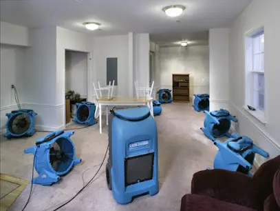 Air movers and dehumidifiers drying a Converse, TX room